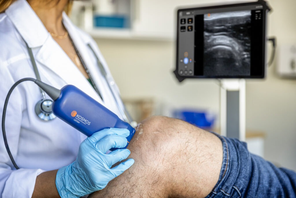 Knee MSK ultrasound scan with diagnostic imaging on screen