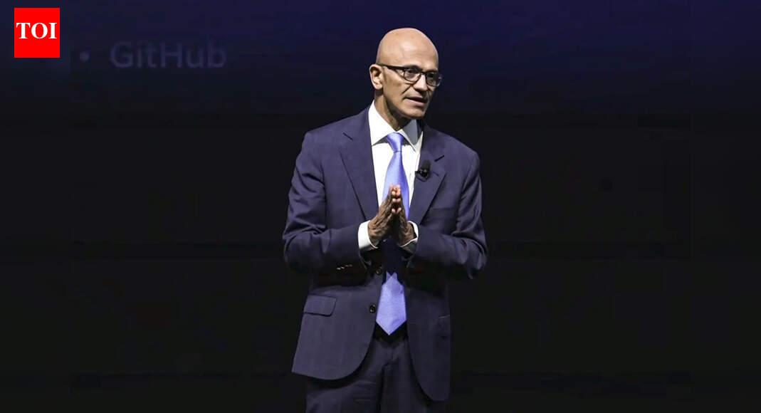 Microsoft CEO Satya Nadella speaking at conference stage