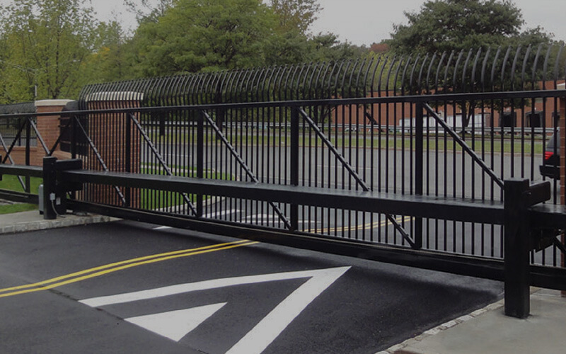 Crash-rated anti-ram gate at a secure facility entrance